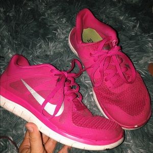 Pink nike running shoes.